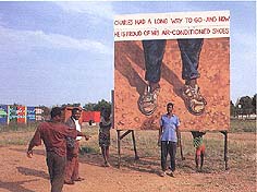 billboard text: Charles had a long way to go - and now he is proud of his air-conditioned shoes